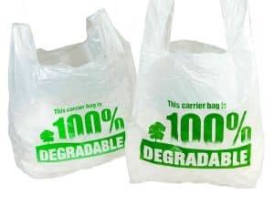 white degradable vest carrier bag with green printed text