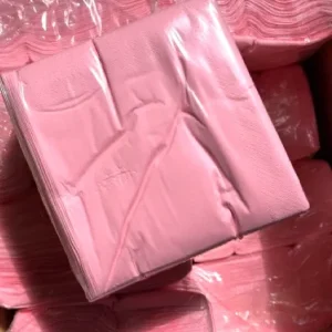 Stack of pastel pink napkins.